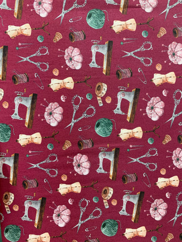 Vintage sewing elements on maroon background (sold in 25cm units)