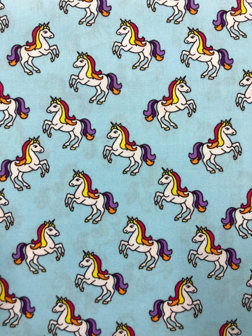 Unicorns on light blue (sold in 25cm units)