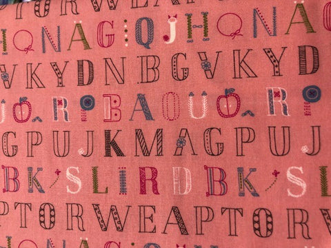 Alphabet letters on pink