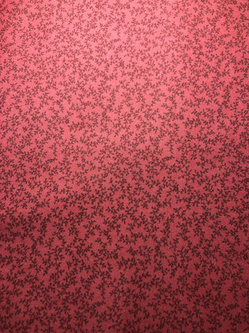 Small brown leave design on pink red background (sold in 25cm units)