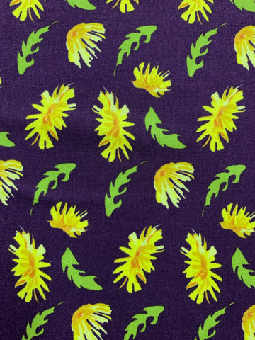 Yellow daisy on dark purple background